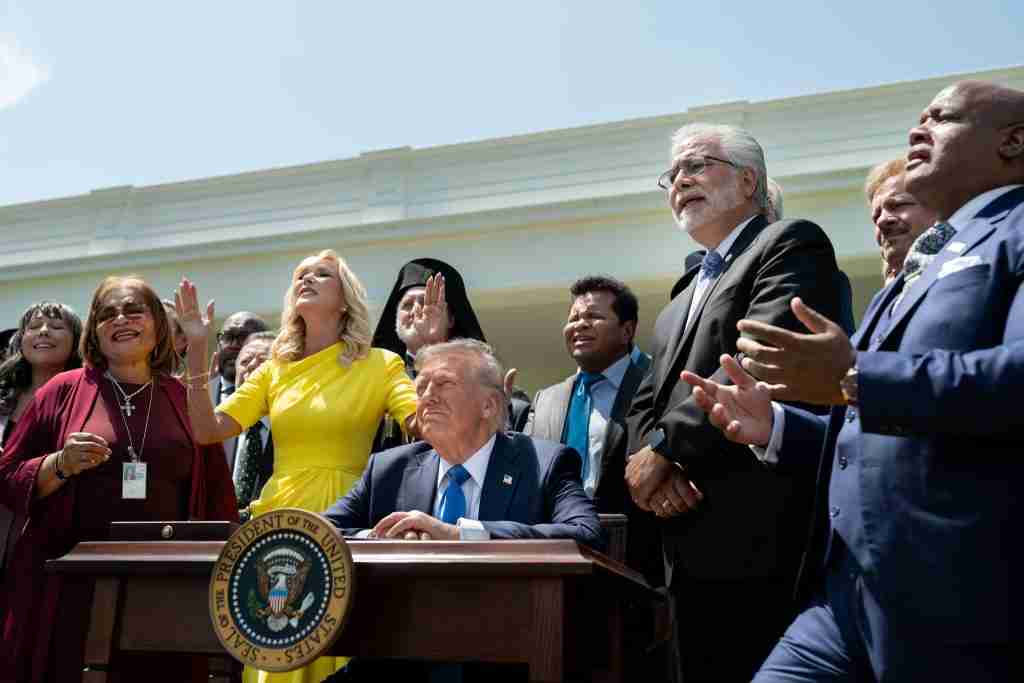 Religious leaders pictured with Donald Trump for the 2025 National Day of Prayer.